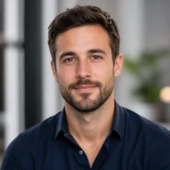 Professional author portrait with a smart casual outfit, natural hairstyle, and neutral background, suitable for editorial we